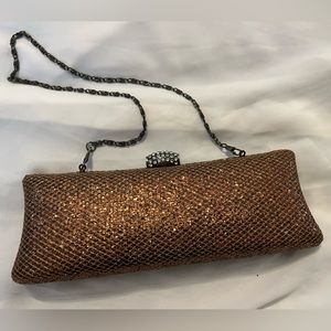 JNB gold copper clutch with studded clasp